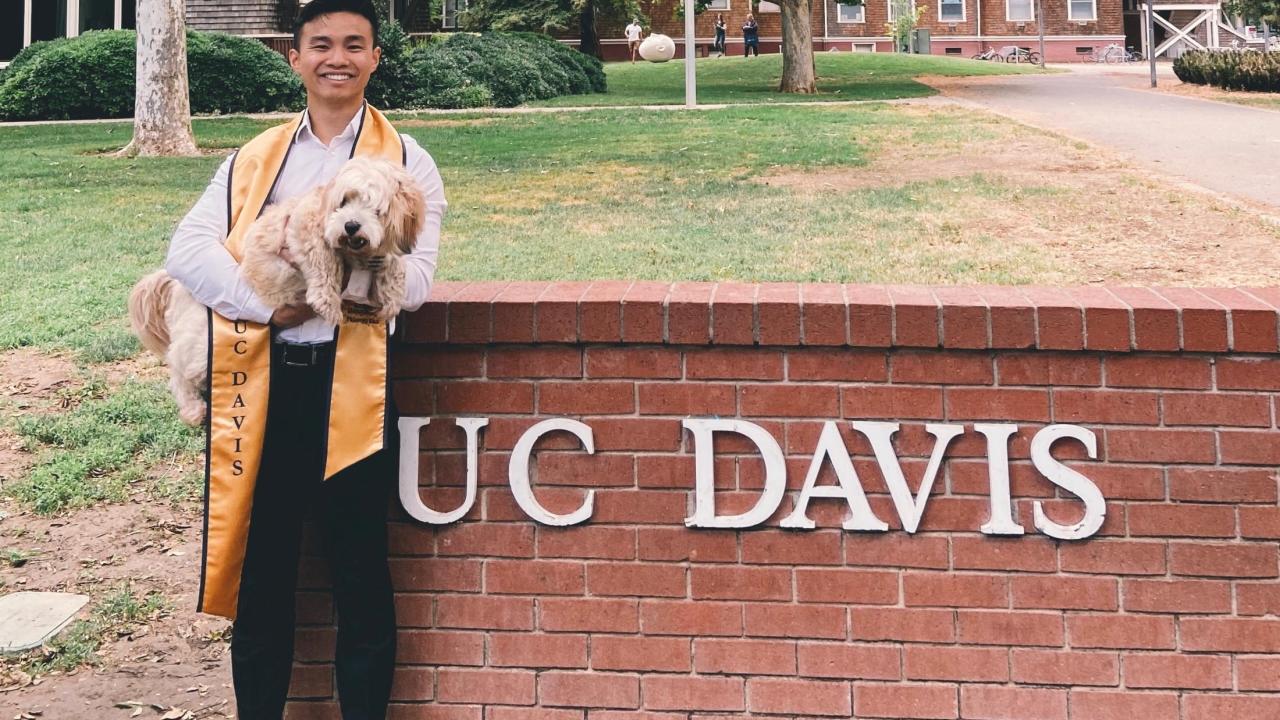 Brandon's graduation picture with his dog, Moppy!