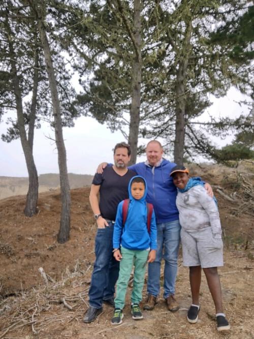 Dr. Blatchford and his family smiling at ano nuevo state park