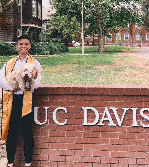 Brandon's graduation picture with his dog, Moppy!
