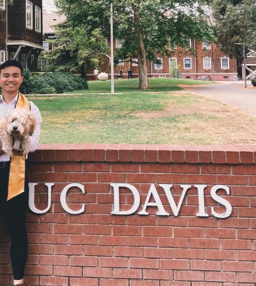 Brandon's graduation picture with his dog, Moppy!