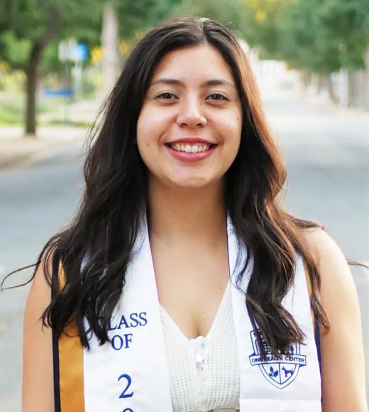 Bianca's profile photo, with graduation stole.